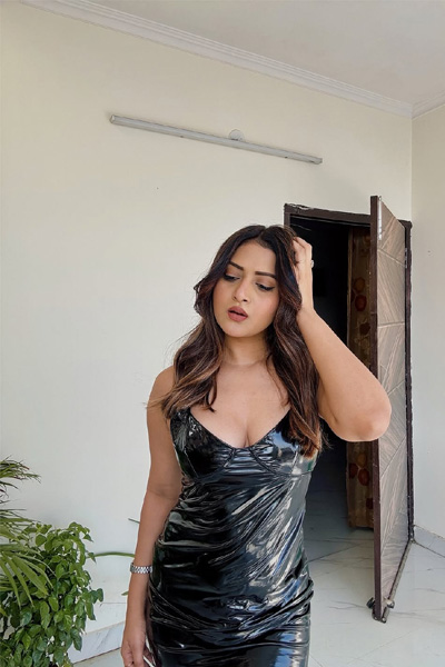 Mahika posing in a stylish outfit, representing confidence and sophistication